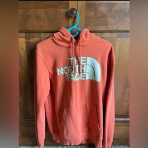 The North Face men’s orange sweatshirt.